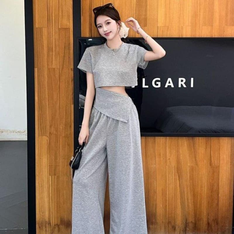 Summer fashionable waistless hot girl fashion suit irregular fake two-piece top shirt + high-waisted wide-leg pants two-piece set