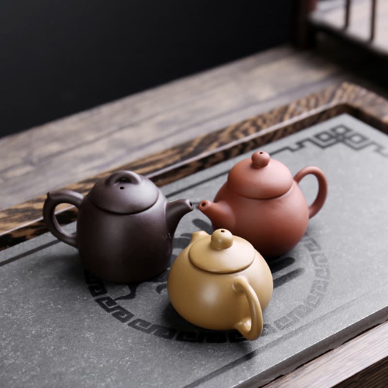 Creative mini purple clay teapot, small milk tea pot, handle teapot, tea plaything, tea set, tea pet ornament, small ceramic factory