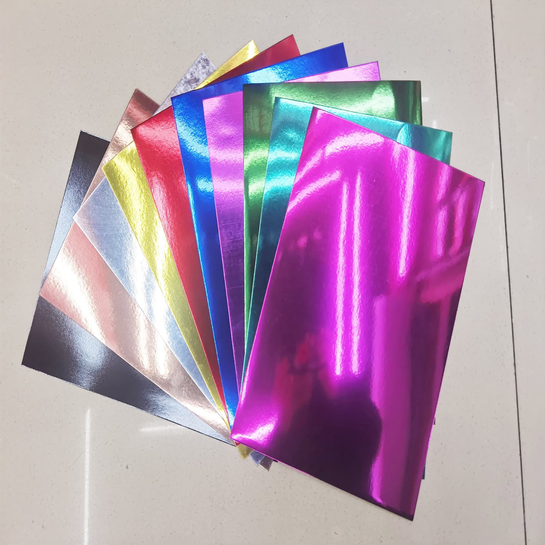 In stock 250g gold and silver cardstock, DIY craft laser paper, mirror PET paper, bright gold and silver packaging specialty paper wholesale
