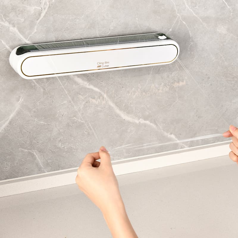 Dual-direction blade cling film cutter, household cling film divider, kitchen wall-mounted drill-free foil cutting box.