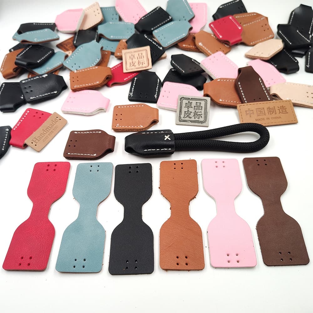 Custom Leather Pull Tabs with Free Sampling, Logo Embossing, Colored Leather Labels, Lanyards, Shaped Leather Cutting, Stitching, and Leather Patches