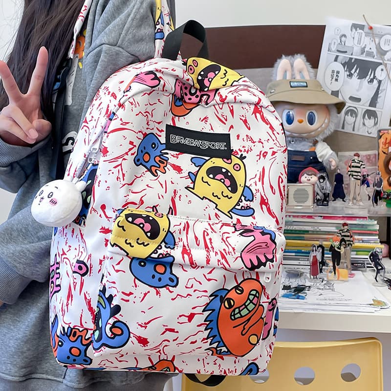 Korean ins style graffiti print backpack female Japanese niche design backpack cartoon cute primary school bag