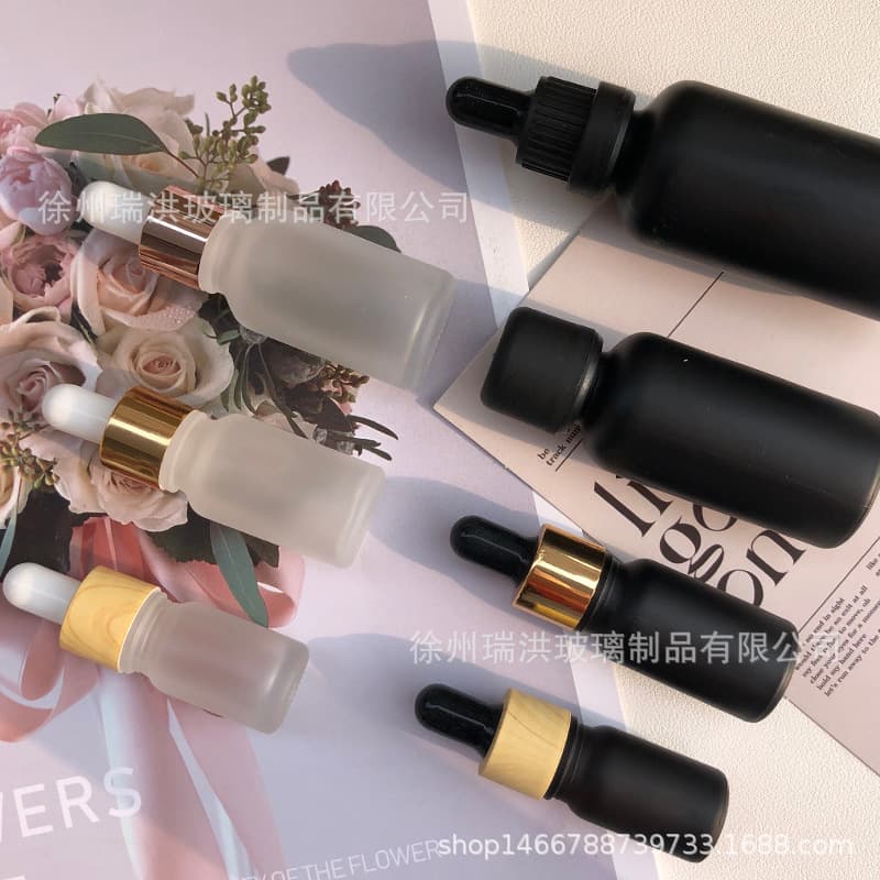 Factory direct tea-colored transparent frosted essential oil bottles, matte black premium dropper bottles for serum/cosmetic dispensing