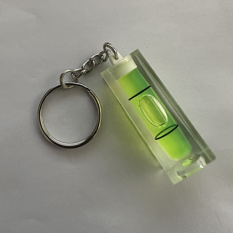 Rectangular portable mini spirit level with keychain, 15*15*40 cm, green. DIY tool.