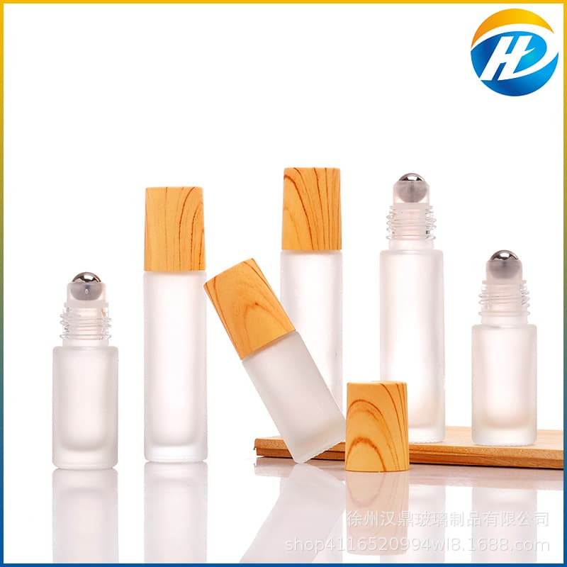 Wholesale Frosted Glass 5ml 10ml Wood Grain Cap Roller Bottle Perfume Refill Bottle Essential Oil Roller Ball Bottle Portable