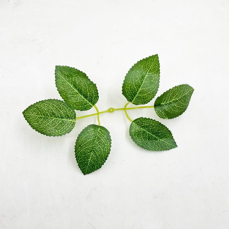 Manufacturer supplies six-pronged silkscreened rose leaf fabric for wedding decoration.