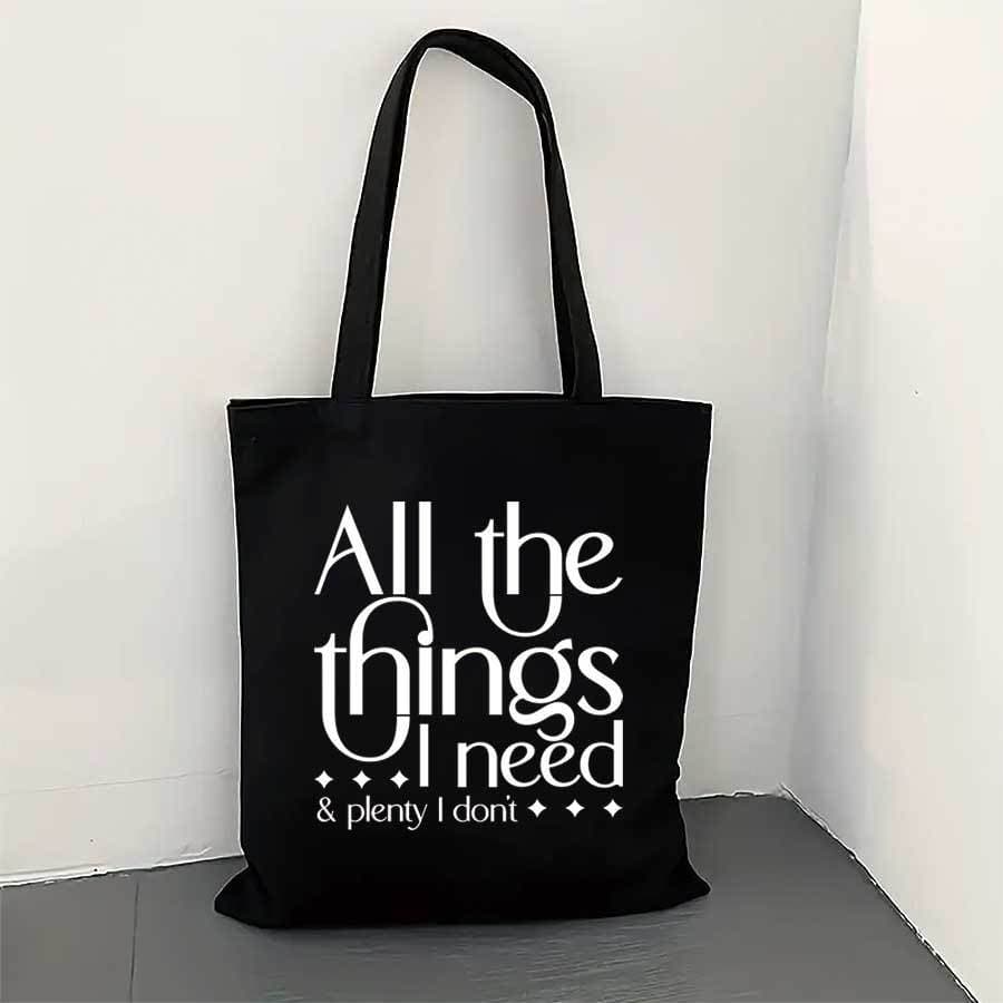 Cross-border hot-selling stylish black canvas tote bag printed with 'All I Need' casual shoulder bag