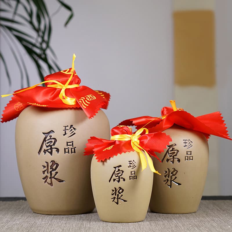 Handmade Yixing ceramic wine jars in 1/2/3/5 jin sizes, wholesale from manufacturers for home brewing.
