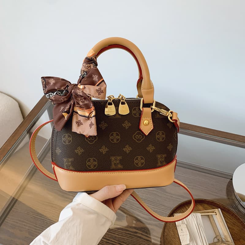 Light luxury presbyopic shell bag women's fashion contrasting color portable crossbody bag 2026 new niche high-end commuter shoulder bag