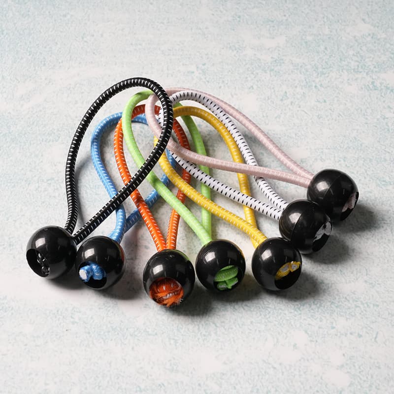 Factory direct stock of elastic ball-shaped ropes for outdoor tents, plastic balls, elastic cords, and trampoline binding ropes.