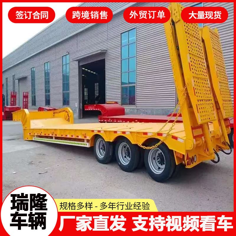Low-bed transport semi-trailers, three-axle hook-lift high-low bed semi-trailers, and heavy machinery transport semi-trailers.