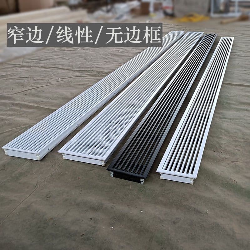 Central air conditioning vent louver grid with narrow, elongated, frameless, minimalist design and recessed linear air outlet.