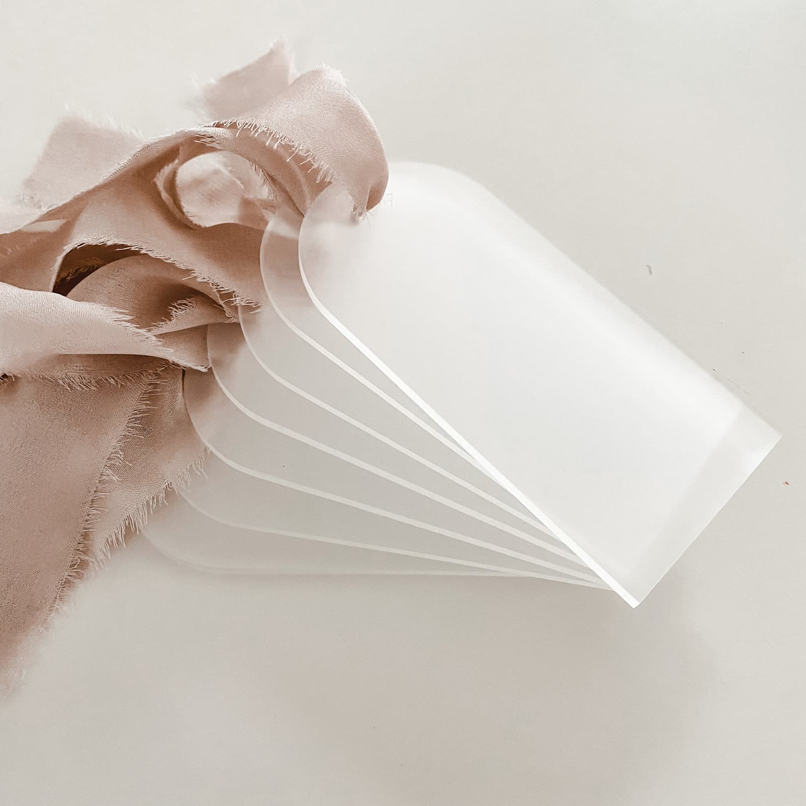 New blank acrylic arched tags with ribbons for wedding seating, party name cards, reserved seat markers