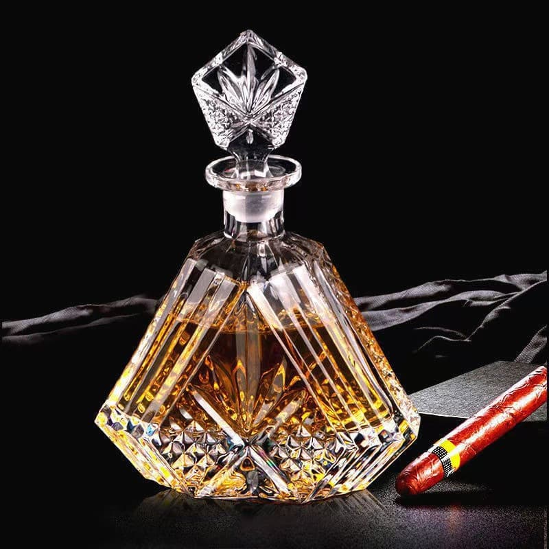 Factory wholesale triangular crystal glass liquor bottles with ground mouth for whiskey and spirits.
