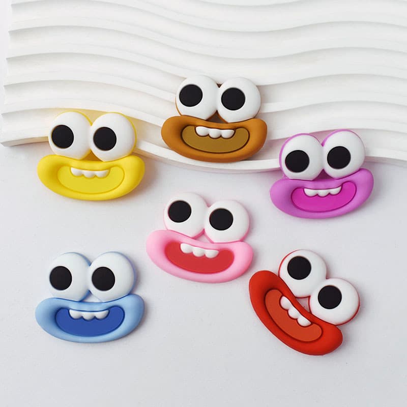 Cute cartoon sausage mouth and eyes storage boxes in various sizes, decorative hair clips, phone cases, and clogs accessories.