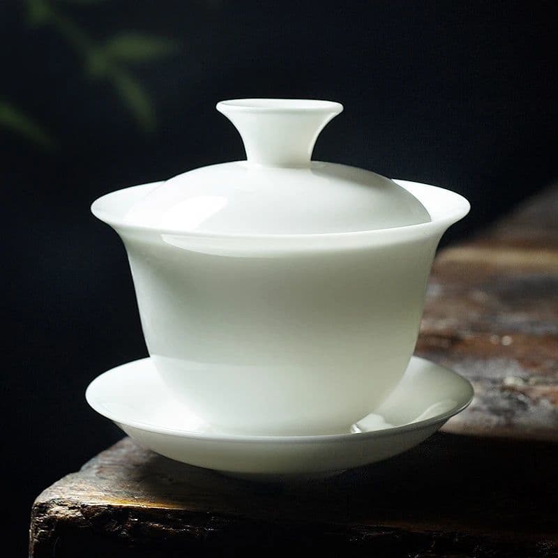 Large-capacity, heat-resistant, white porcelain gaiwan (three-piece set) for tea brewing, perfect for home, office, or as a gift.