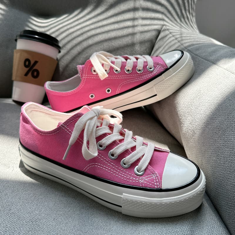 New colors: 1970s platform low-top, pink and dark green.