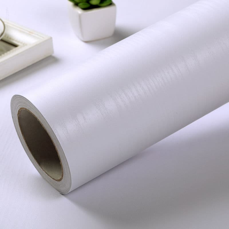 PVC self-adhesive wallpaper with wood grain texture, suitable for desktops, cabinet doors, wardrobes, and furniture renovation. Thickened wood-look wall stickers by Zhao Zhou.