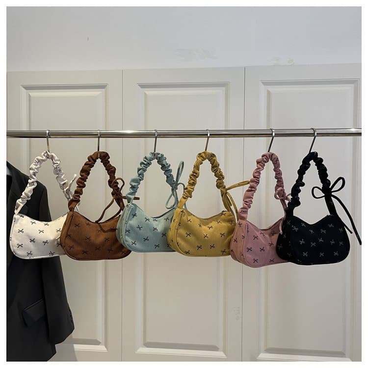 New 2026 foreign trade bow shoulder bag niche design women's portable commuter bag high appearance and versatile small bag