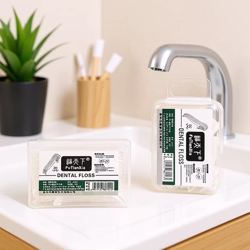 Household disposable high elastic dental floss stick portable flat floss toothpick arch cleaning floss box wholesale manufacturer