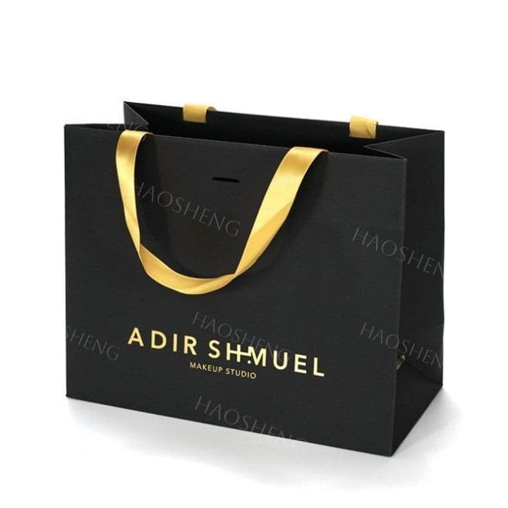 High-end UV gold embossed printed logo, luxury black paper bag, gold hand-held ribbon gift bag