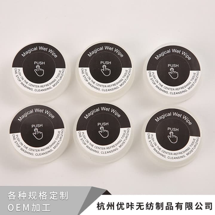 Wholesale disposable portable creative press wet wipes for general cleaning, individually packaged with dry and wet separation.