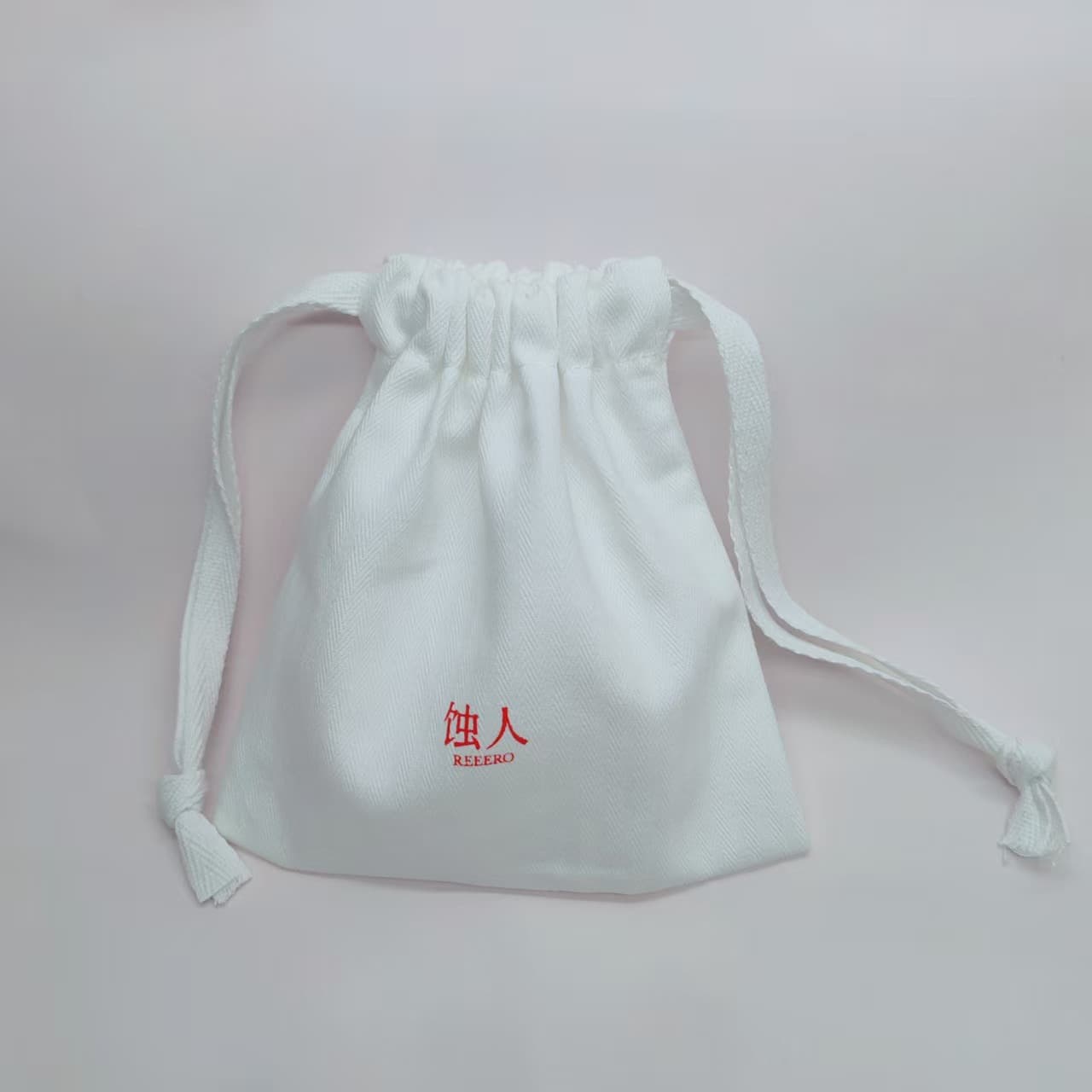 Custom drawstring canvas bag with logo printing, scented pouch for travel skincare and beauty device storage, free design service.