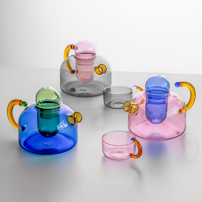 Creative color-blocked high-temperature resistant glass teapot with tea-water separation filter, suitable for home use with electric ceramic stoves and tea brewing.