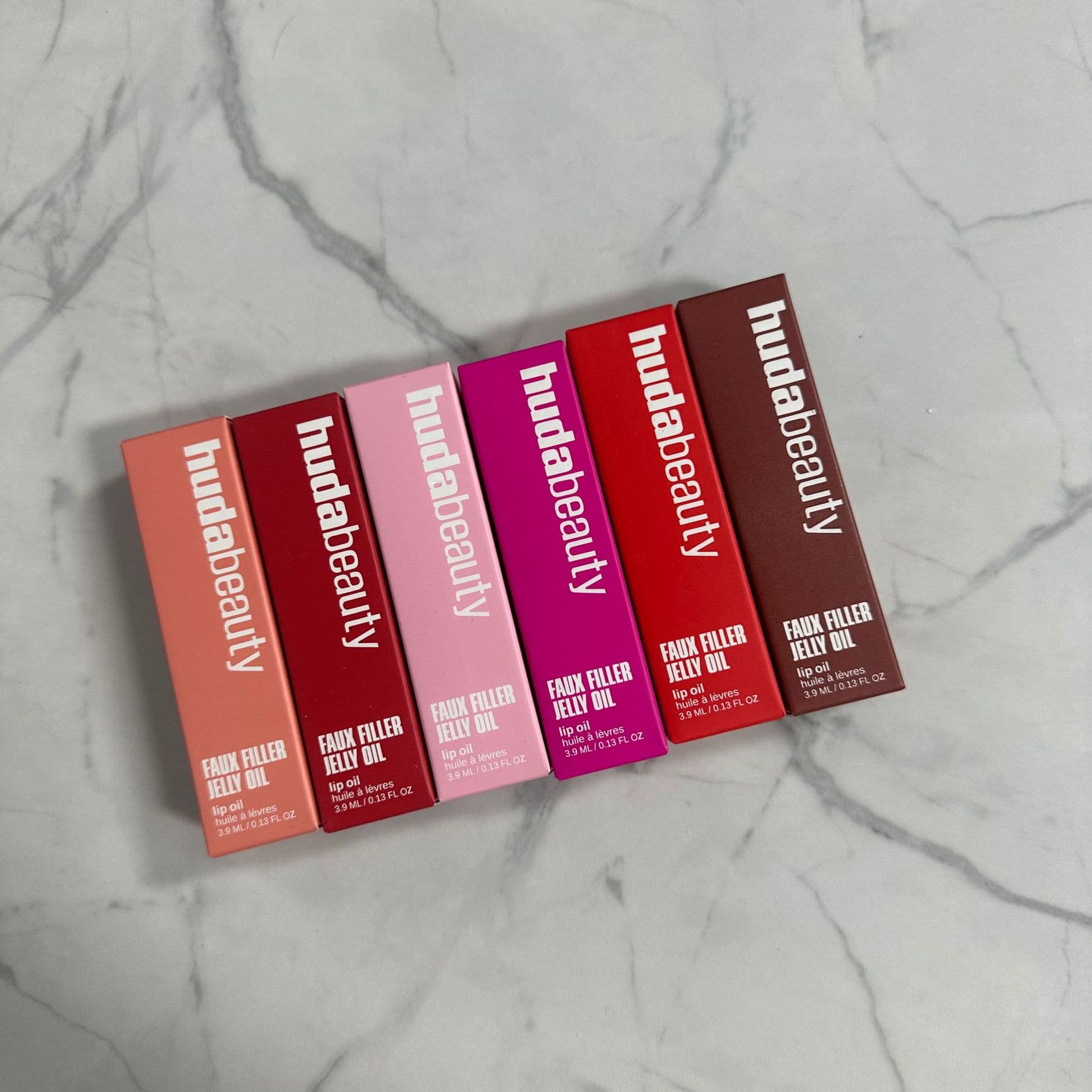 Cross-border In Stock HUDA Beauty Ultra Moisturizing Gel Lip Oil Faux Filler Transparent Glossy Hydrating Lip Gloss