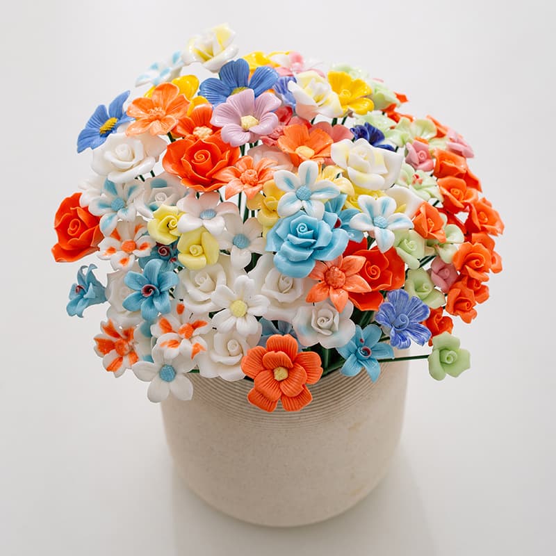 Handcrafted ceramic flower stems with everlasting roses and daisies mix, multi-colored viral hit on Xiaohongshu.