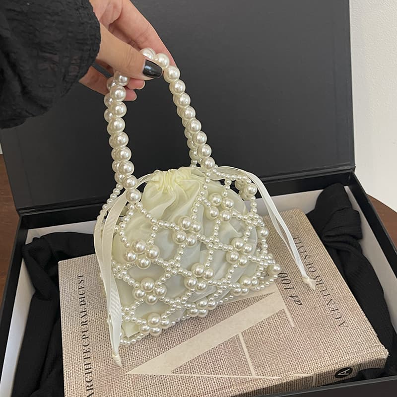 2026 Internet celebrity pearl beaded bag niche design ribbon hollow handbag girl exquisite mini crossbody bag