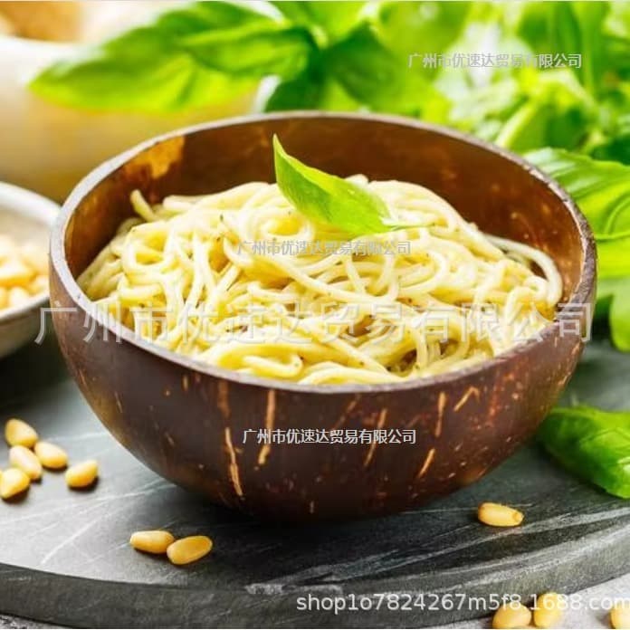 Naturally degradable coconut shell bowls from Southeast Asia with biodegradable spoons, made from aged Hainan coconut shells for fruit salads.
