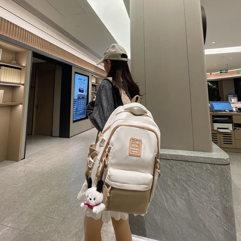 Japanese-style schoolbag for women, workwear style, Korean style, large capacity, color-blocked backpack for junior high school students, travel backpack for high school students and men.