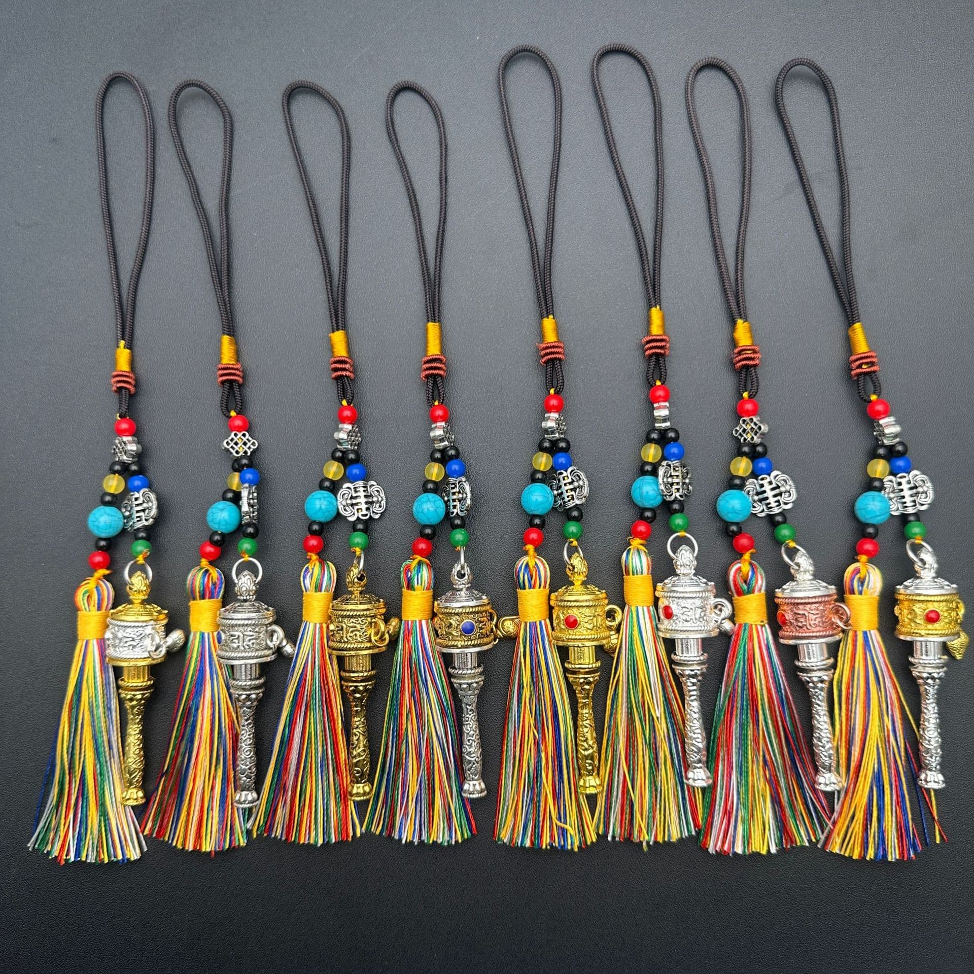 Wholesale car ornaments, tassel decorations, car interior bags, keychains, scenic area gifts, Tibetan style, rotatable, hand-cranked.