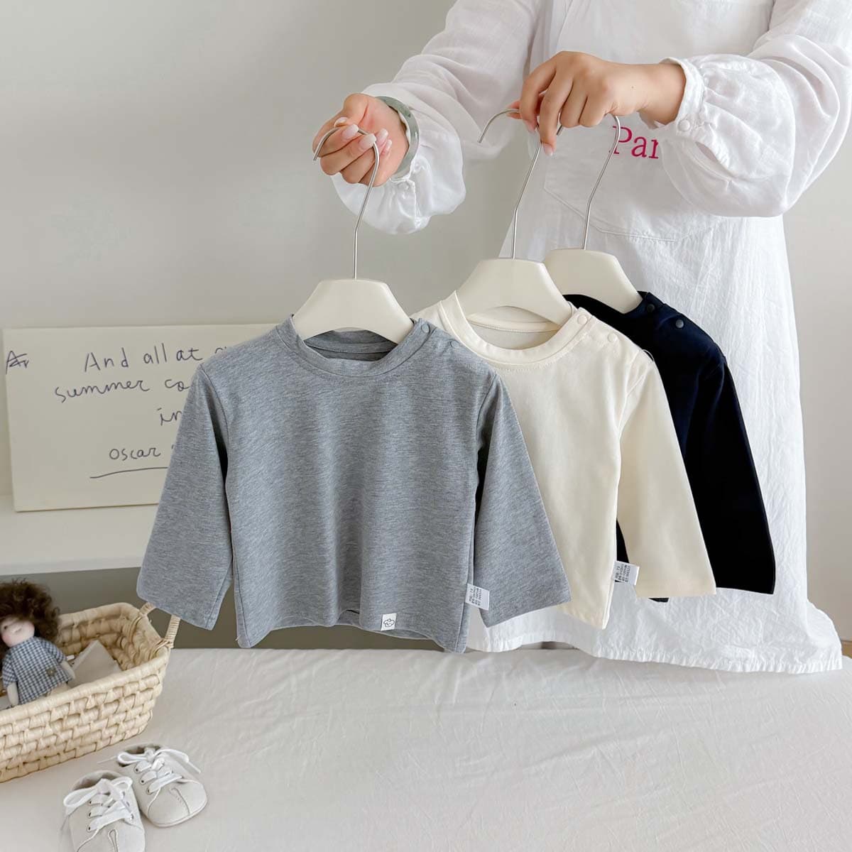 Spring and autumn new baby long-sleeved T-shirt children's pure cotton open shoulder button top solid color versatile top for boys and girls