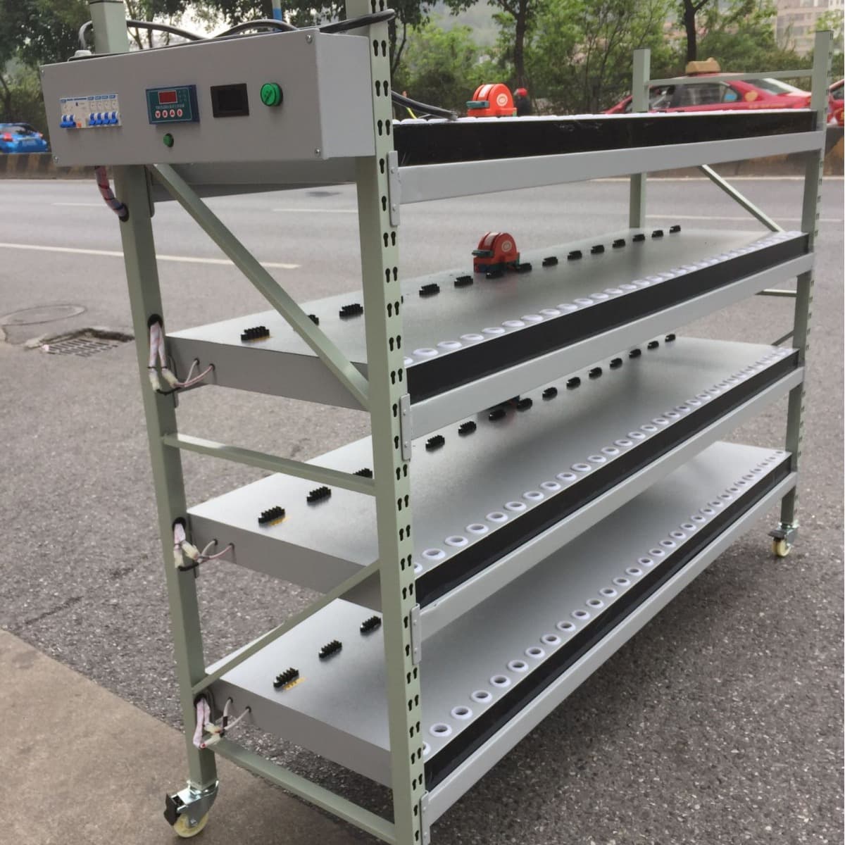 Automotive headlight high/low beam compatible aging test burn-in racks and cabinets for H1-H11 bulb types.