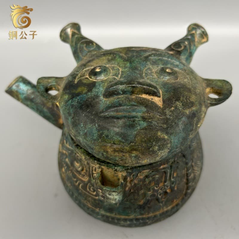 Replica of human-faced dragon pattern He from Yin Ruins, Anyang, Henan, imitation ancient bronze wine vessel, Freer Gallery of Art collection