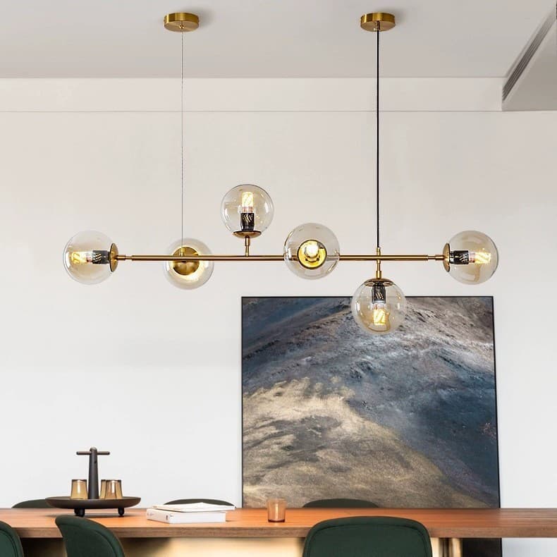A long, rectangular, bean-shaped pendant light in a Scandinavian style, suitable for restaurants, and featuring a bronze-gold finish. Also suitable for front desks, bars, and other shops. Features include a unique glass LED pendant light.