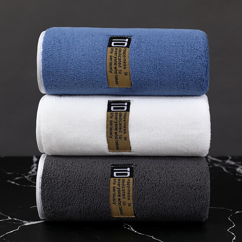 Thickened, soft, absorbent, lint-free coral fleece towel for home use, adult face towel, comfortable and quick-drying.