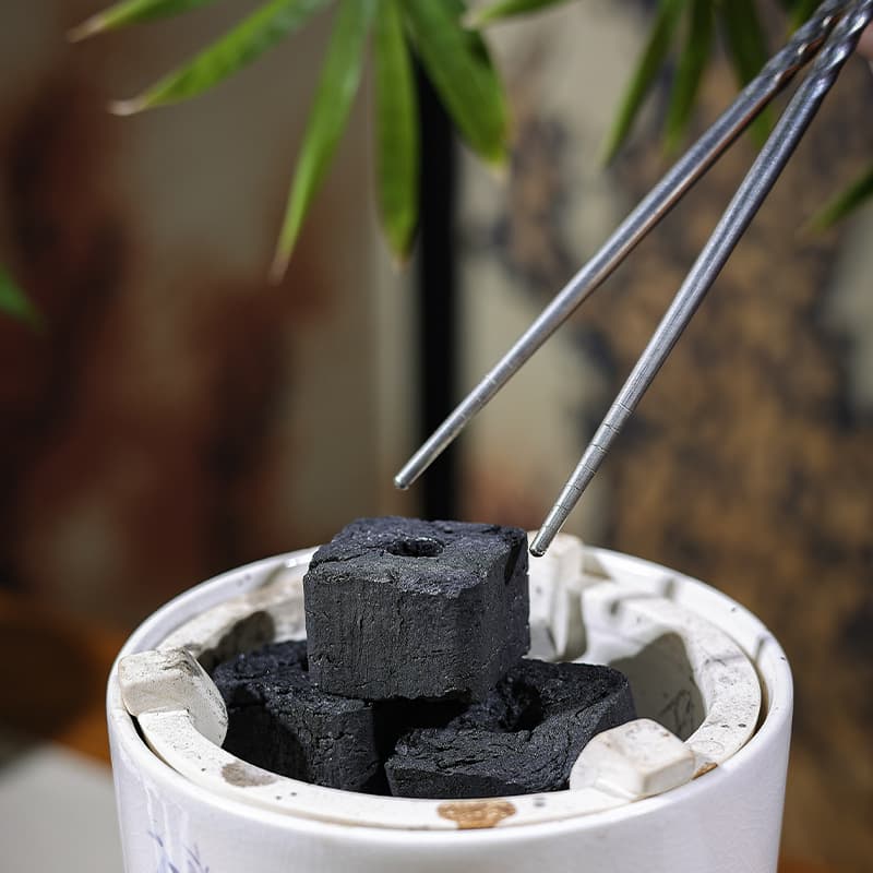 Small-block smokeless charcoal for stove cooking, tea brewing, barbecue, home environmentally friendly heating, and bamboo roasting.