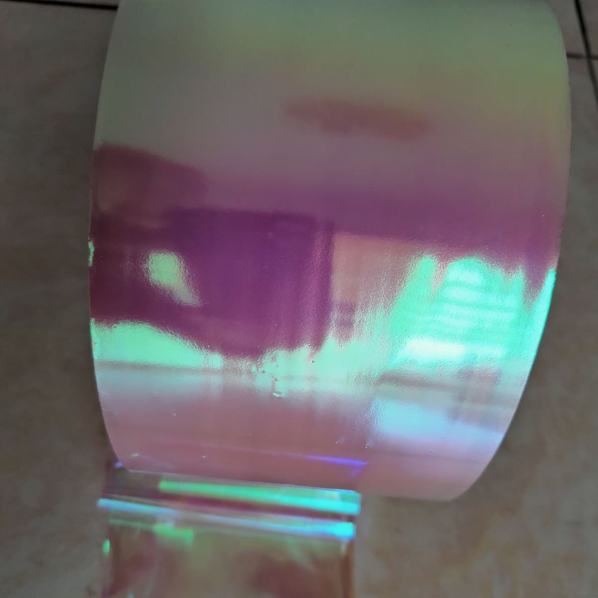 Pearl white iridescent adhesive film, 1.2 mil semi-transparent deep blue metallic color stripe, deep red spray-coated film.