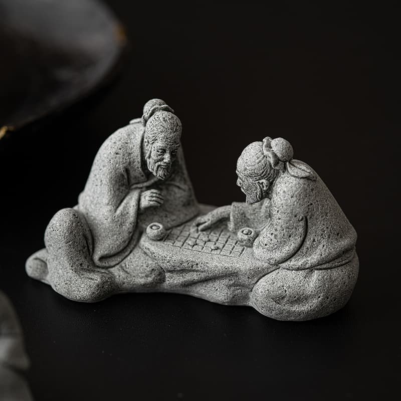 Chinese-style chess-playing immortal tea pet ornament, creative blue sandstone design, old man playing chess, fish tank decoration, tea table and study room decoration.