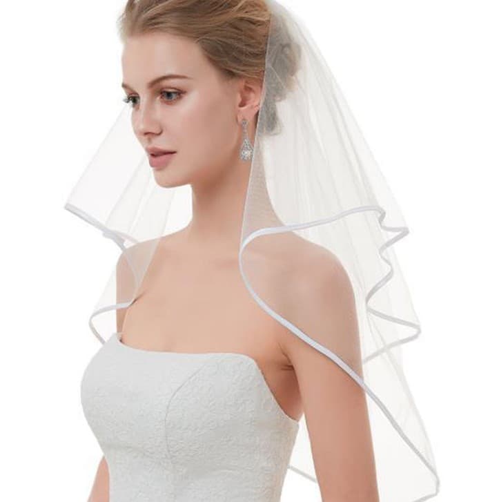 Wholesale bridal wedding veils, double-layered satin ribbon-edged multi-layered veils with hair combs and headpieces, supplied by the manufacturer.
