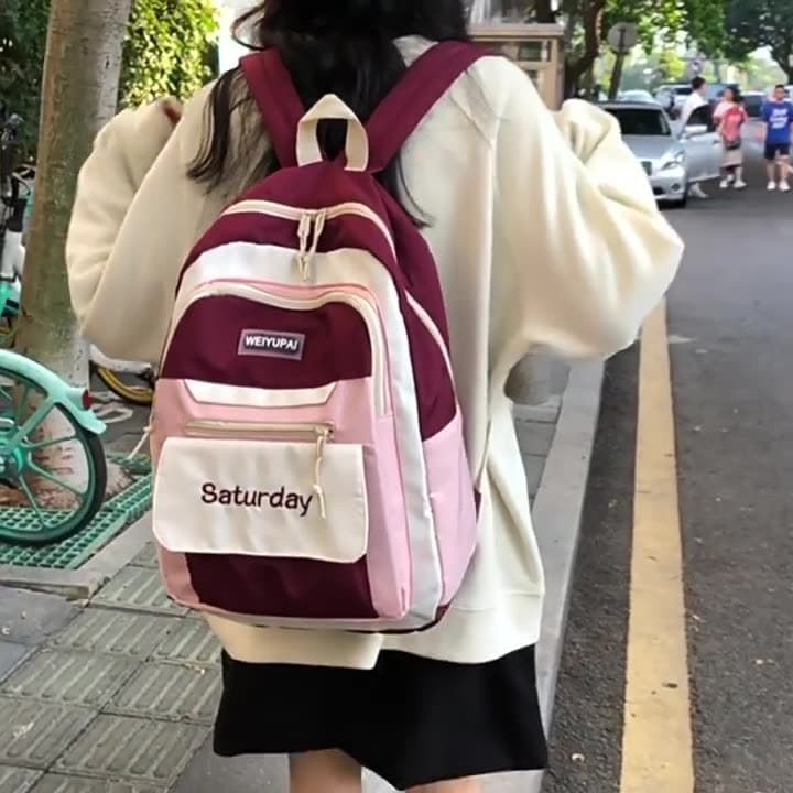 Women's backpacks with color blocking, stylish design, large capacity, suitable for junior high, high school, and university students, perfect for the start of the school year.