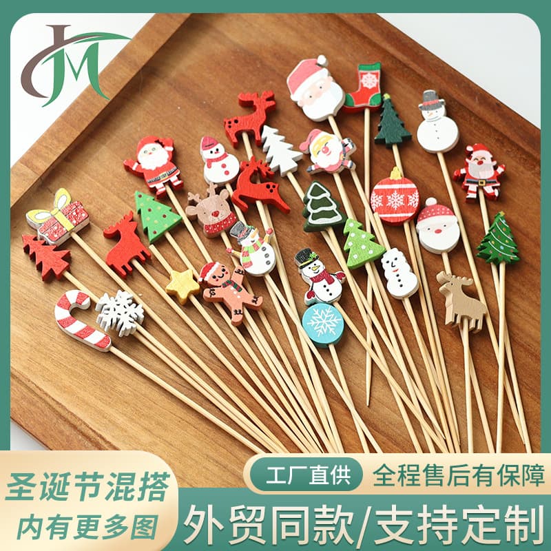 Christmas-themed fruit picks (100/pack) including Santa Claus, pine tree, and reindeer designs on disposable bamboo picks