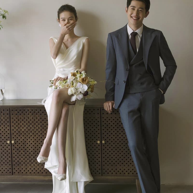 French-style wedding dress, light and simple, forest-inspired, travel photography, high-end, floor-length white dress, bridal gown for greeting guests and toasting
