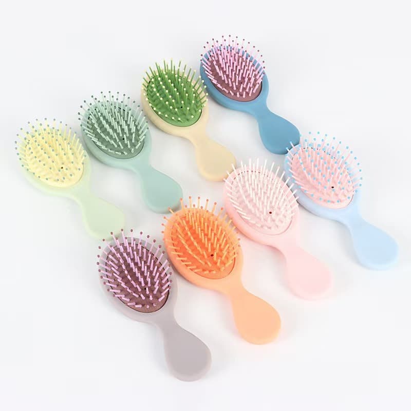 Internet celebrity cartoon macaron color air cushion comb, small and cute hair smoothing comb for girls, portable anti-static household comb