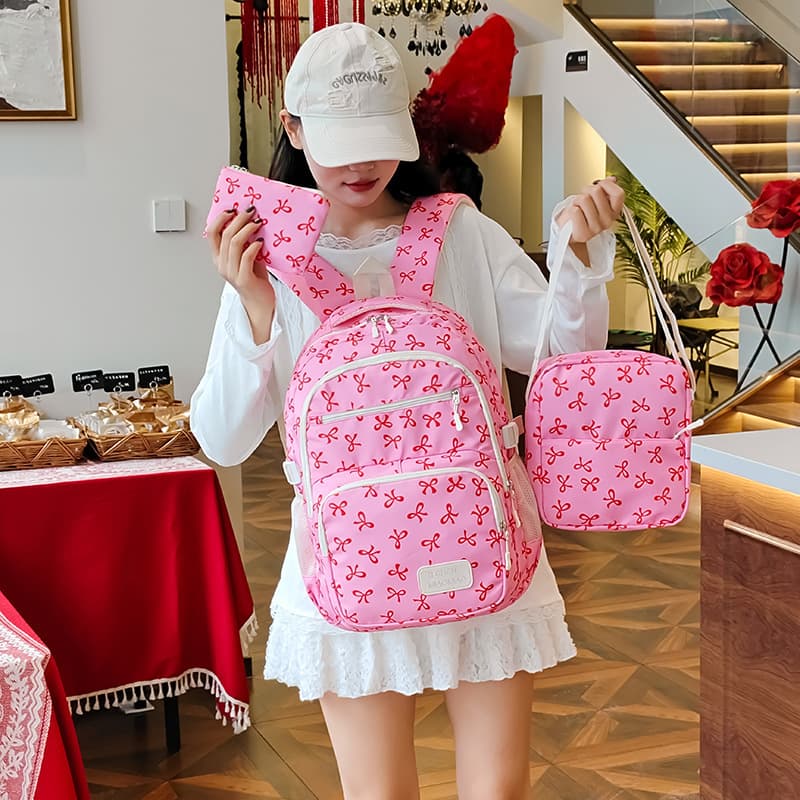 New bow backpack, three-piece schoolbag for female students, lightweight, burden-reducing, waterproof junior high school backpack