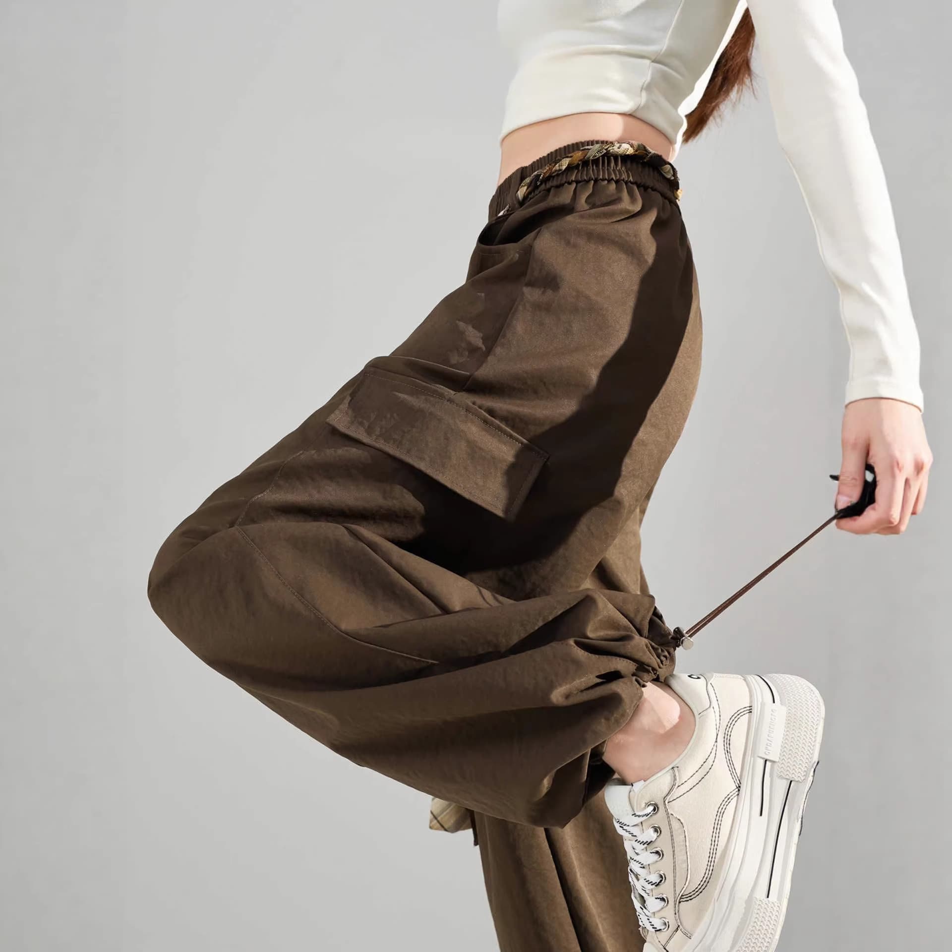 European Amber Streamer Wind Scimitar Overalls Women's Autumn 2026 New High Waisted Loose Foot-binding Mountaineering Sports Pants