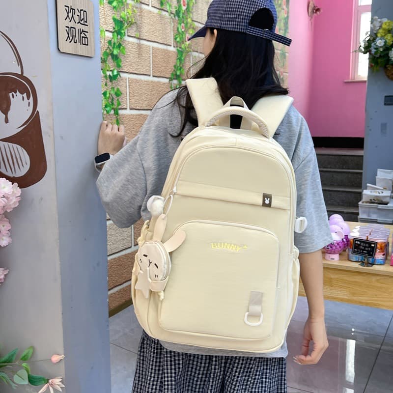 High-value solid color schoolbag for women, large capacity, burden-reducing backpack for grades 3-6, middle and high school students, multi-layer backpack
